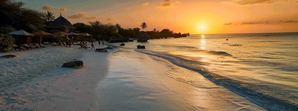 a breathtaking view of the sun setting over the tranquil shores of jambiani beach, with soft waves lapping against the pristine white sand and silhouetted figures enjoying a serene safari experience in the background.